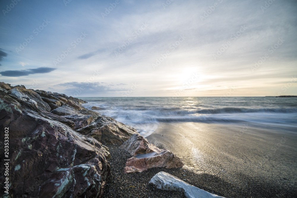 Fototapeta premium Beautiful sunset over the Sea in Tuscany in Italy (long exposure)