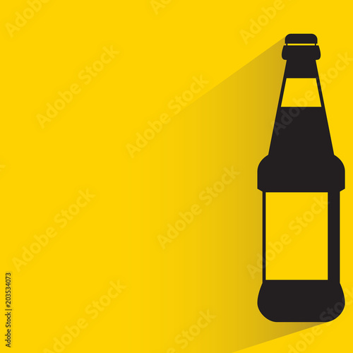 beverage bottle with drop shadow on yellow background