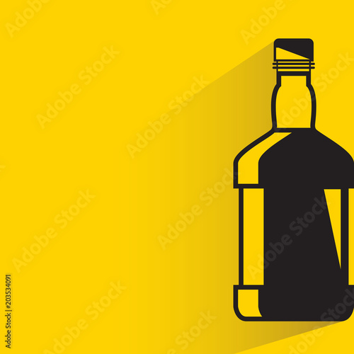 beverage bottle with drop shadow on yellow background