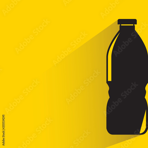 beverage bottle with drop shadow on yellow background