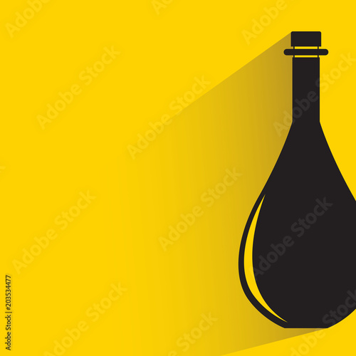 beverage bottle with drop shadow on yellow background