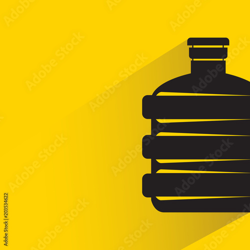 beverage bottle with drop shadow on yellow background