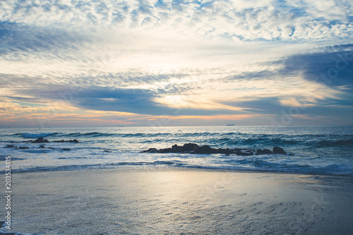 An amazing sunset on the coast at the ocean © Julia