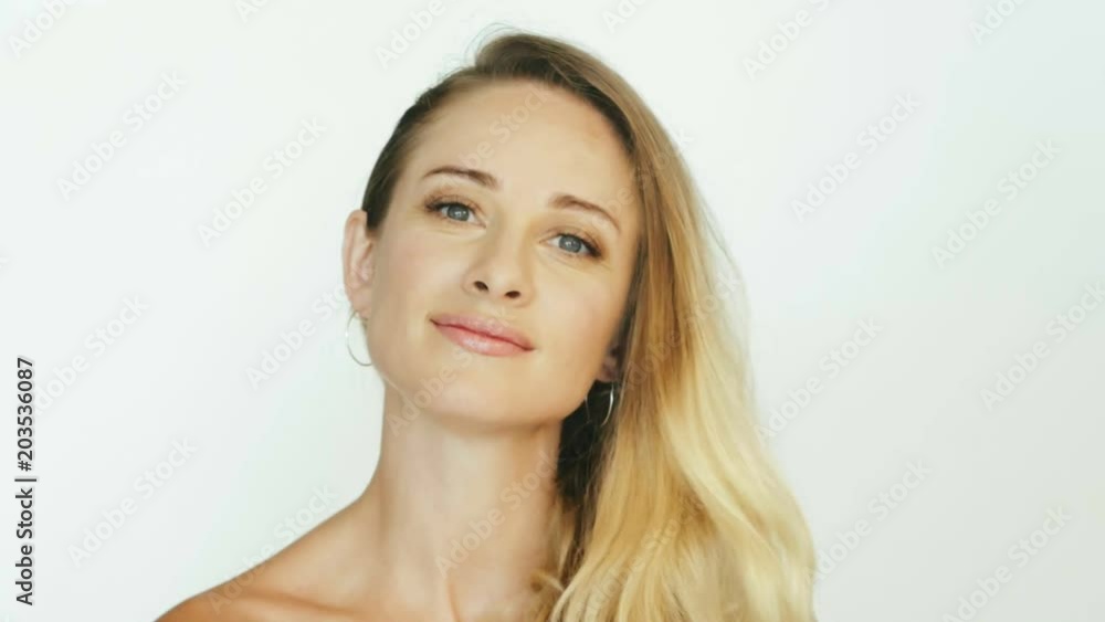 Beautiful woman looking into camera for shooting video blog Beautiful woman looking into camera for shooting video blog