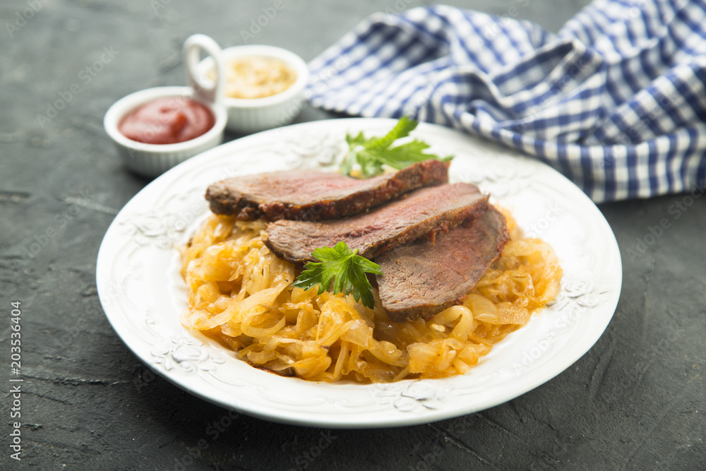 Beef fillet serves with sauerkraut