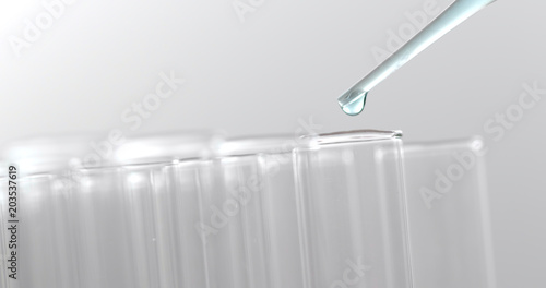Pipette dropping sample into test tube