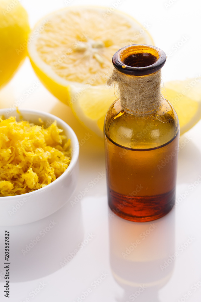 Lemon essential oil on a white background Lemon essential oil on a white background