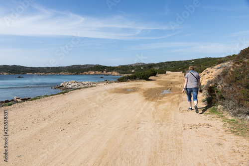 woman walking on caprera island