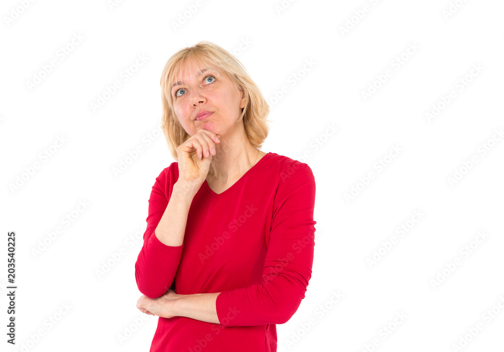 Middle-aged woman thinks, dreams, she looks up. Adult 50 year old woman. Middle-aged woman thinks, dreams, she looks up. Adult 50 year old woman.