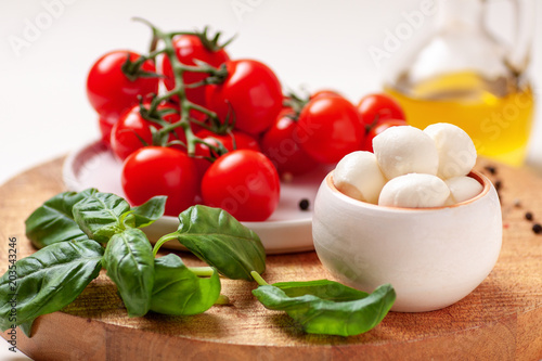 Tomatoes, basil, mozzarella cheese. Caprese salad ingredients