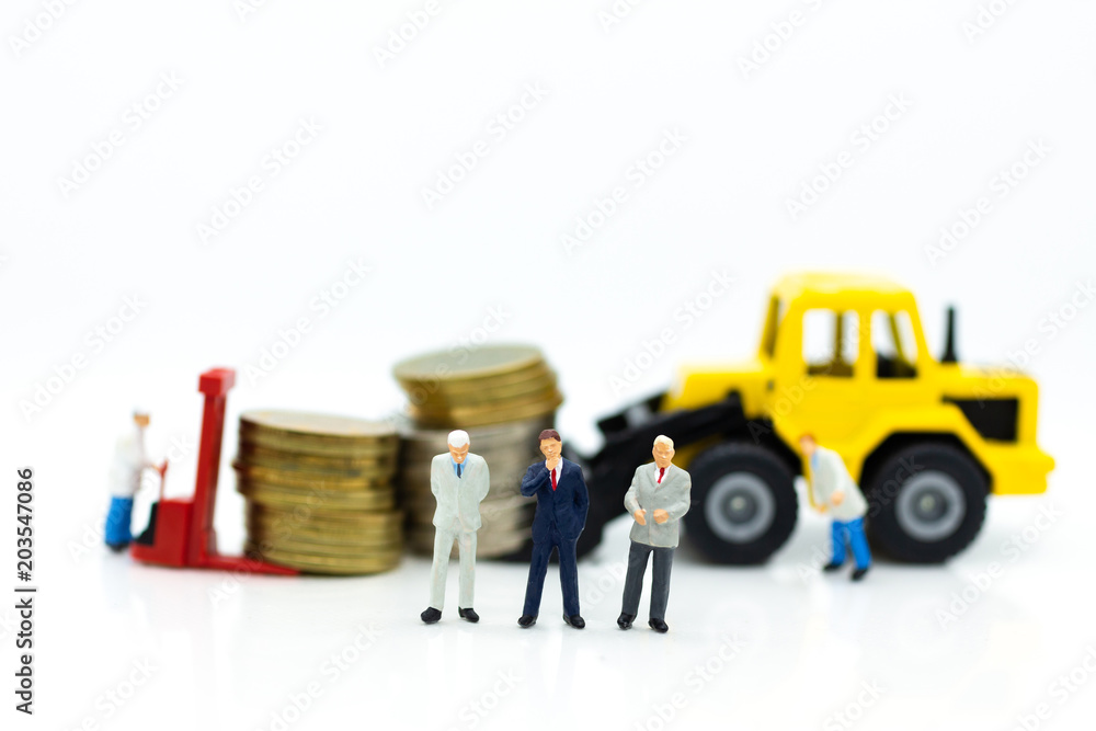Miniature people: Worker use pallet truck with stack of coins. Image use for background business concept. Miniature people: Worker use pallet truck with stack of coins. Image use for background business concept.