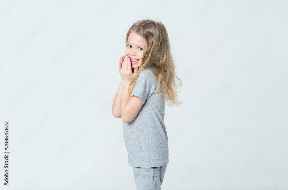 Happy little girl, smiling face, on a light background. Happy little girl, smiling face, on a light background.