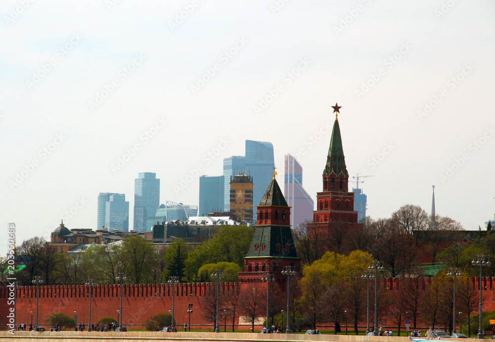 The Borovitskaya and The Secret (Tainitskaya) towers of Moscow Kremlin. View on Moscow city (centre). Russia, May 2018.