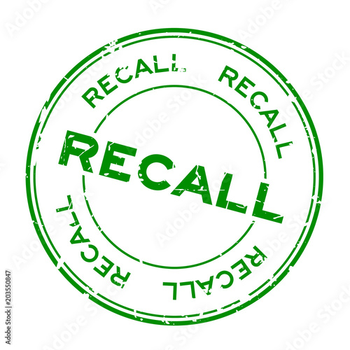 Grunge green recall round rubber seal stamp on white background