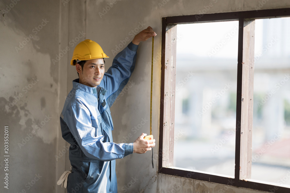 Technician man working with wearing yellow safety helmet. Technician man working with wearing yellow safety helmet.