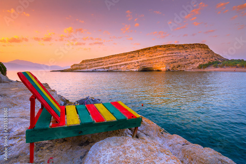 Fototapeta Naklejka Na Ścianę i Meble -  Matala beach with caves on the rocks that were used as a roman cemetery and at the decade of 70's were living hippies from all over the world, Crete, Greece