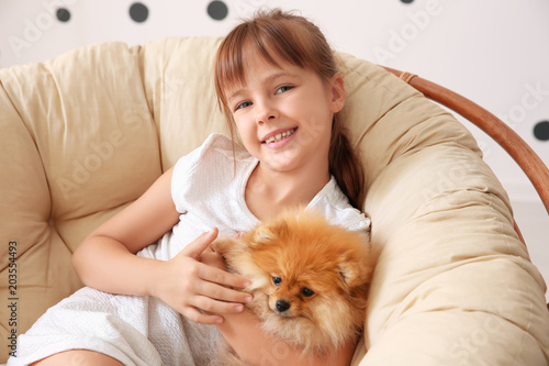 Cute girl with little dog i...