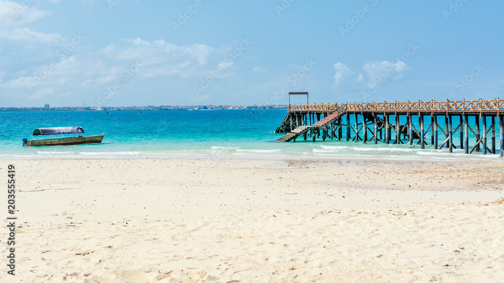 Wooden pier at Prison island near Zanzibar,  Beautiful turquoise water and white sand near Zanzibar, Tanzania
