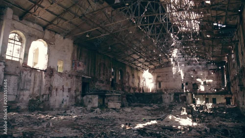 large ruined and demolished abandoned factory hangar or warehouse, post apocalyptic disaster concept, toned large ruined and demolished abandoned factory hangar or warehouse, post apocalyptic disaster concept, toned