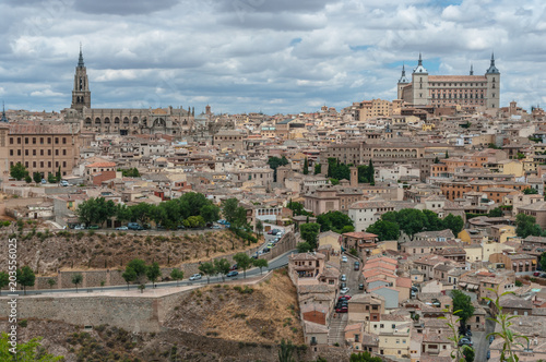 Landscape of Toledo, Spain, with Alcazar, the river Tajo and a dramatic sky with clouds. 