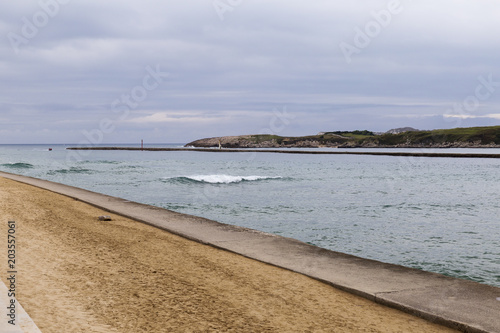 entrance to a port on the coast on a cloudy day  