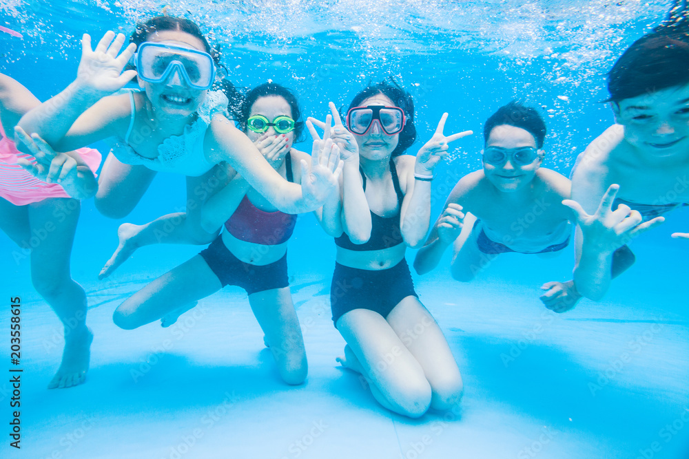 little kids swimming in pool