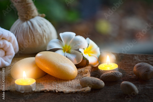 Spa concept with organic soap and burning candles in the dark