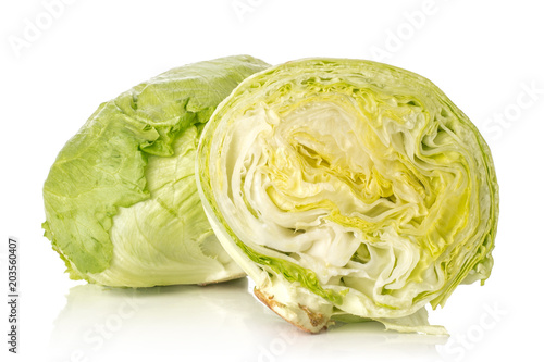 Iceberg lettuce one fresh green cabbage head and section half isolated on white background. © PIXbank