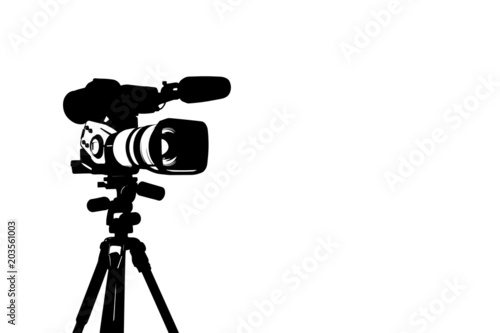 Professional video camera set on a tripod isolated on white background.