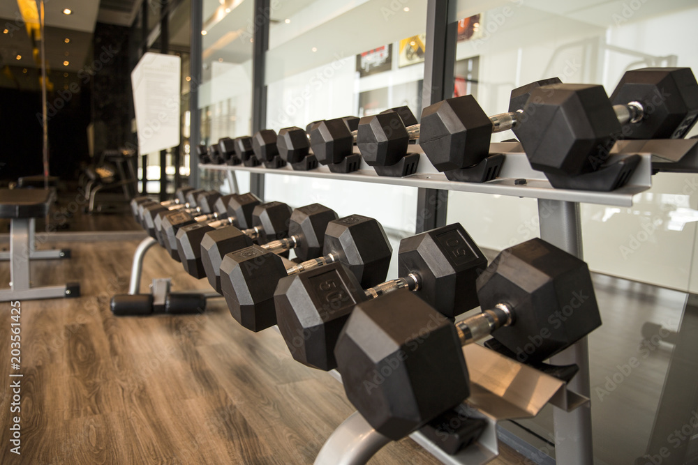Obraz premium Sports dumbbells in modern sports club for a exercise in the fitness center in gym,Weight Training Equipment