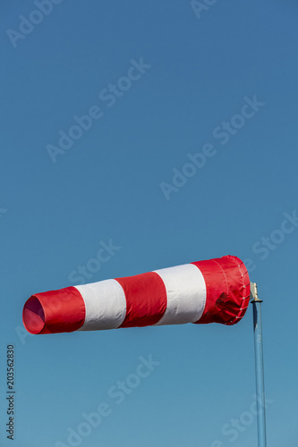 windsock in front of blue sky