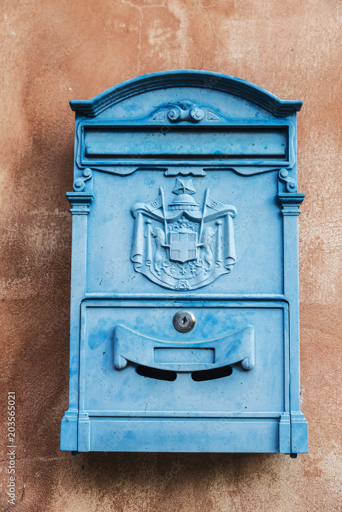Old blue retro mailbox in Ragusa in Sicily, Italy