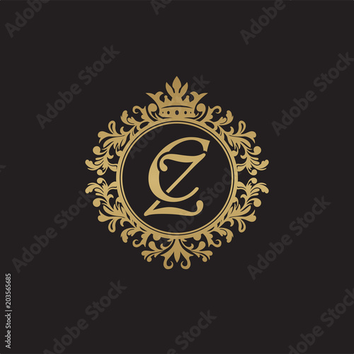 Initial letter CZ, overlapping monogram logo, decorative ornament badge, elegant luxury golden color