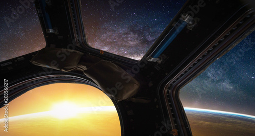 Fototapeta Naklejka Na Ścianę i Meble -  Landscape with Milky way galaxy. Sunrise, Earth and Spacecraft view from space with Milky way galaxy. (Elements of this image furnished by NASA)