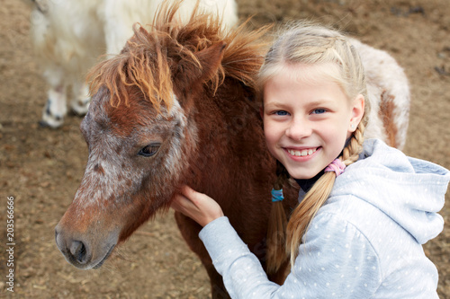 Pony and horsewoman - little girl and her best friend