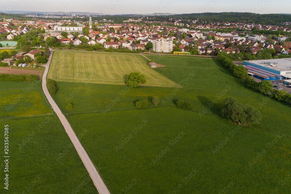 Luftbild mit Blick über die Wiesen nach Korntal in Baden Württemberg
