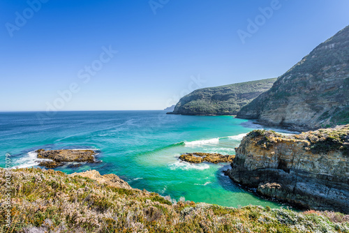 Tasman Peninsula, Tasmania, Australia: Scenic coastline of rocky cliff Tasman arch with old stone formations dramatic structures near blue wild ocean perfect hiking landscape countryside Port Arthur