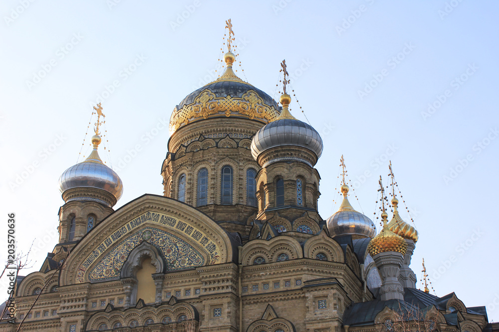 Church of the Assumption of Blessed Virgin Mary in St. Petersburg, Russia. Religious City Landmark, Russian Orthodox Cathedral Building. Exterior Close Up View with Facade Details and Golden Domes.