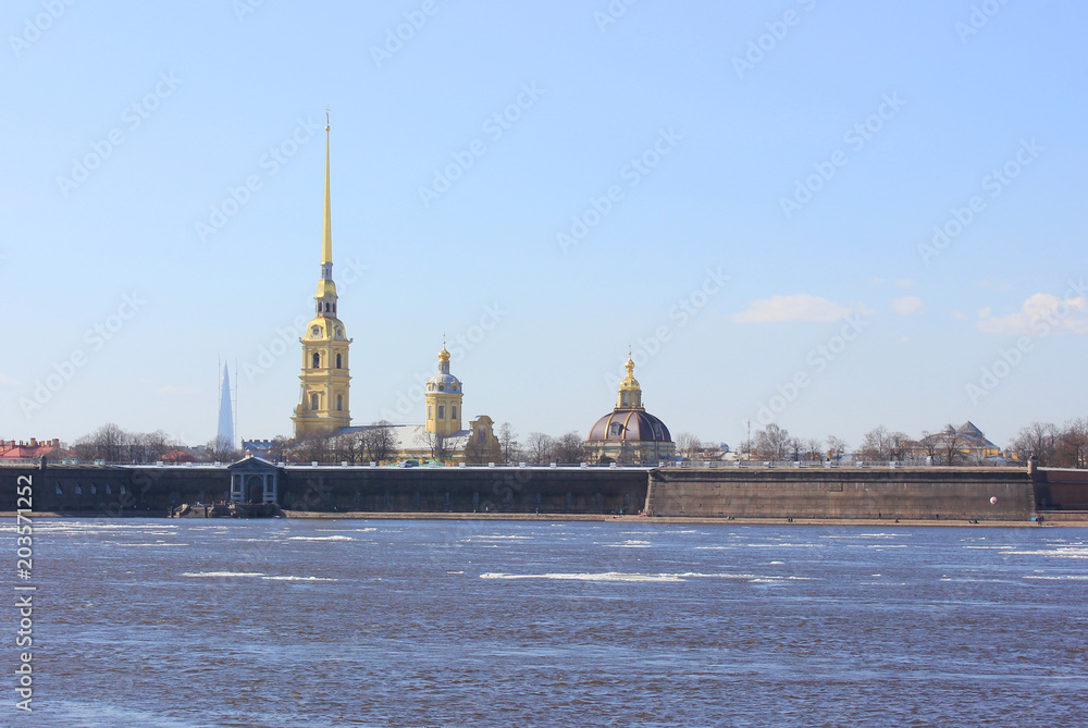 Peter and Paul Fortress Close Up View in Saint Petersburg, Russia. Original City Citadel Founded by Peter the Great in 1703. Winter Scene Wallpaper of Popular Travel Sight across Neva River Water.