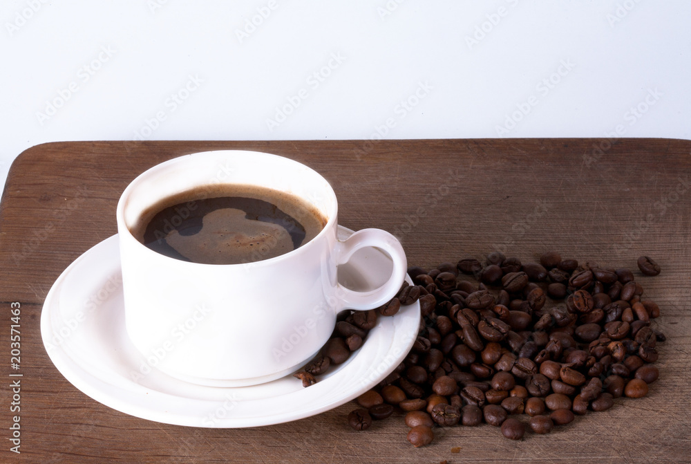 Coffee cup and beans on old kitchen table. Top view with copyspa Coffee cup and beans on old kitchen table. Top view with copyspa