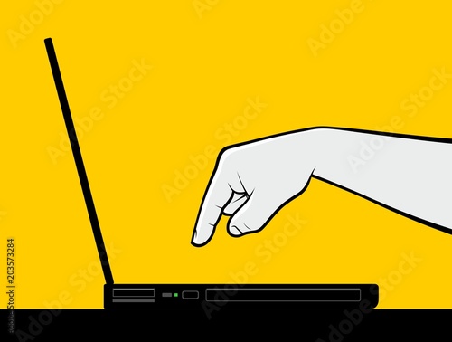 Finger pressing key in laptop keyboard