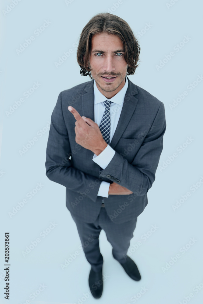 Handsome businessman showing finger point up Handsome businessman showing finger point up