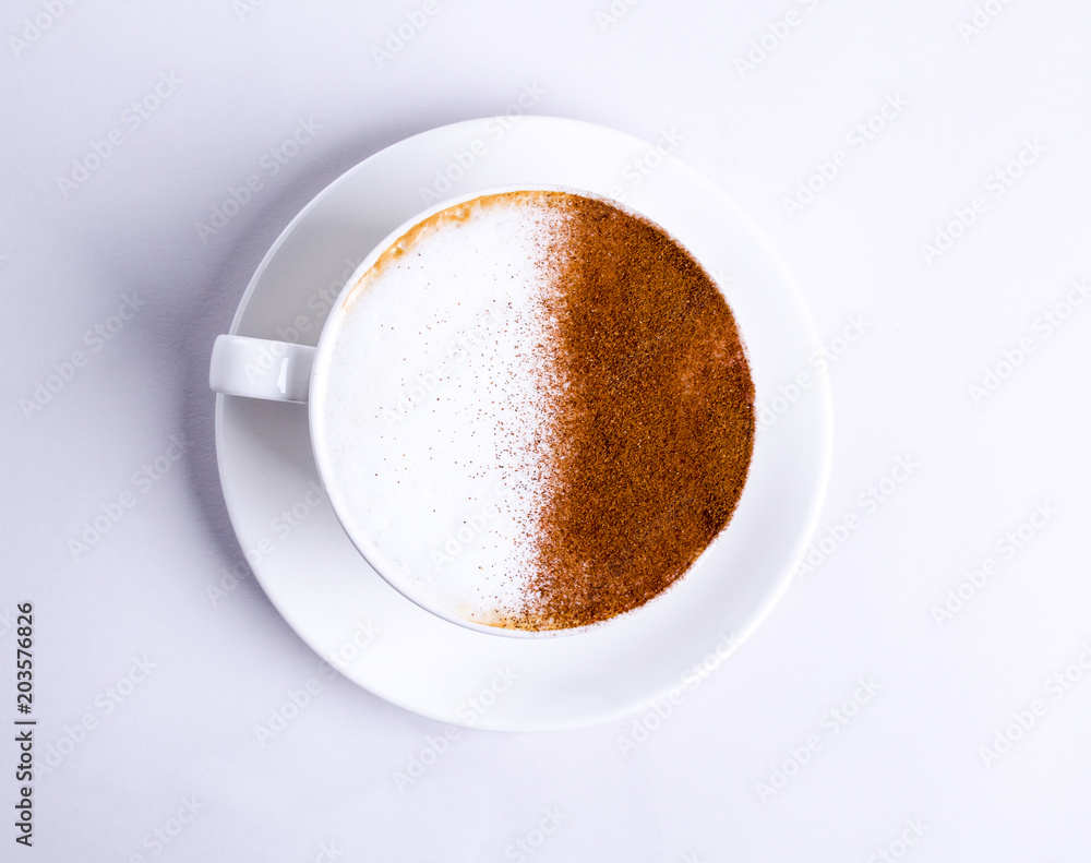 Top view of hot coffee latte cappuccino on white background. Drink in a cup on a plate, morning Top view of hot coffee latte cappuccino on white background. Drink in a cup on a plate, morning