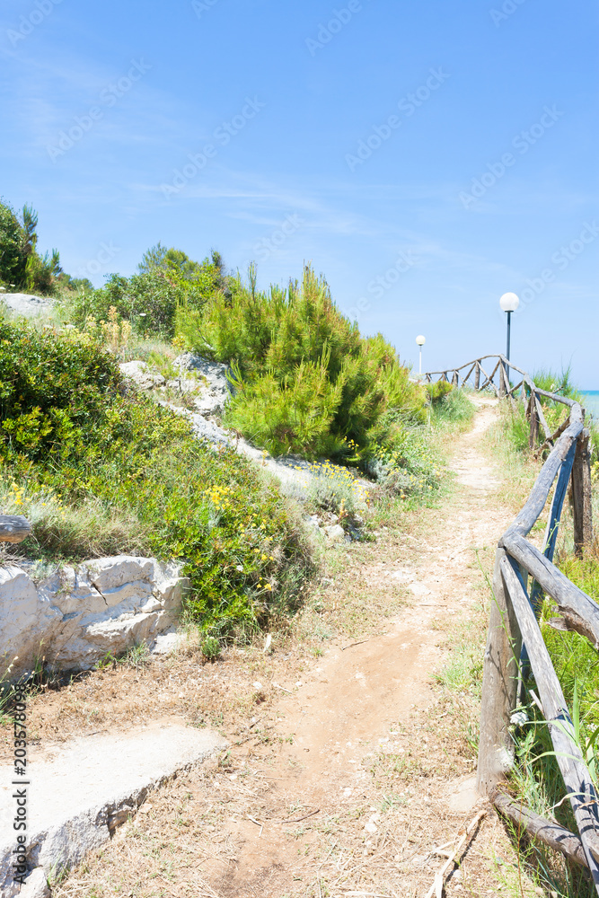 Lido Cala Lunga, Apulia - Hiking trail at the coastline of the Mediterranean Sea Lido Cala Lunga, Apulia - Hiking trail at the coastline of the Mediterranean Sea