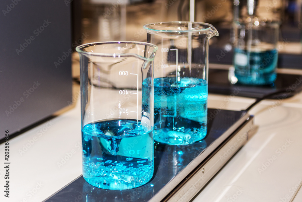 A device for mixing medical fluids in a laboratory