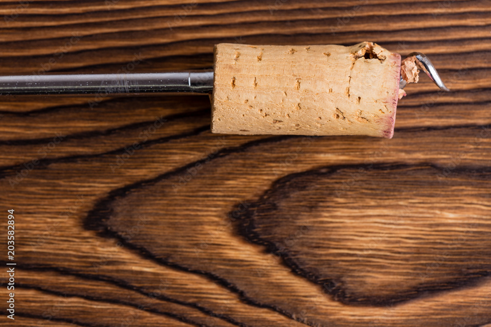Close up view of corkscrew with wine cork