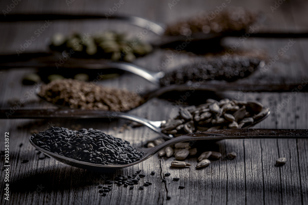Spoons with assortment of seeds