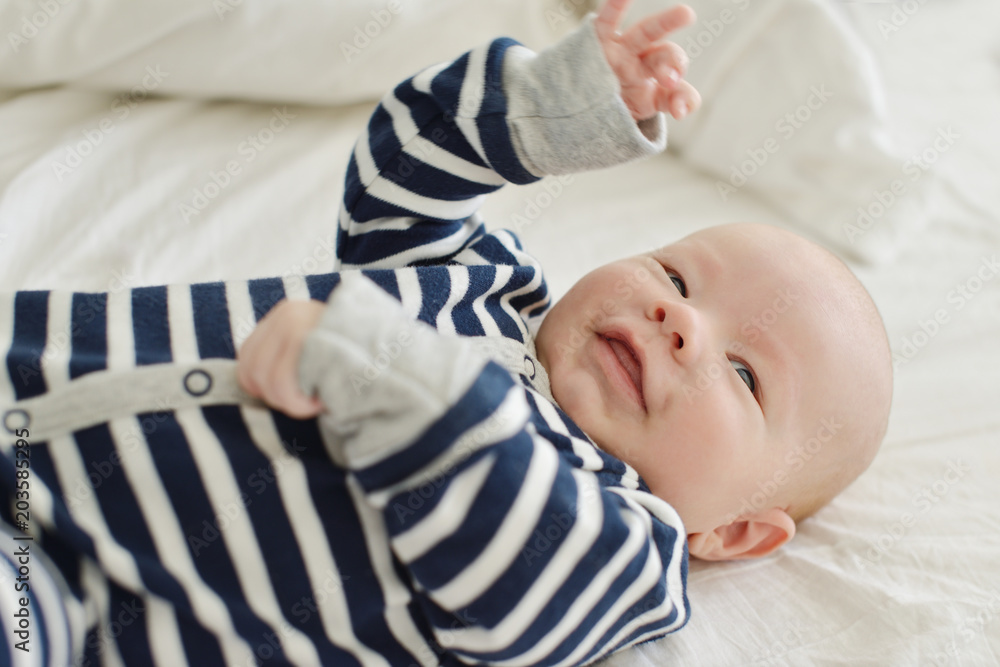happy baby on the bed