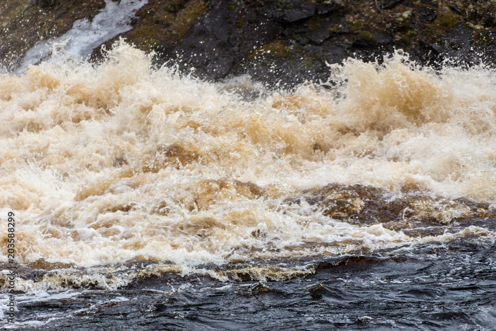 Stormy mountain river with large waves Stormy mountain river with large waves