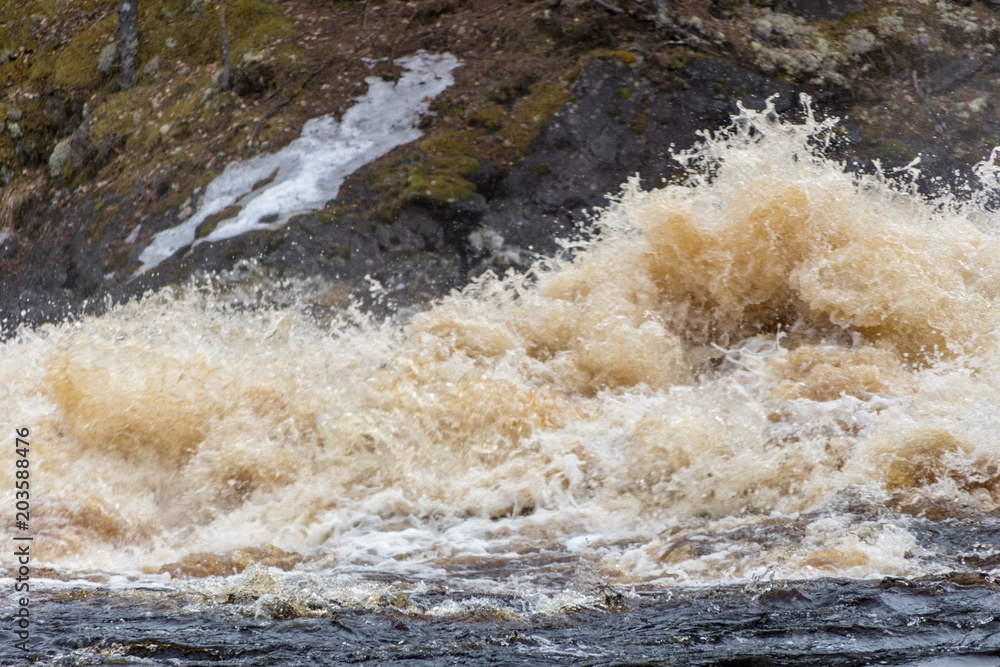 Stormy mountain river with large waves Stormy mountain river with large waves